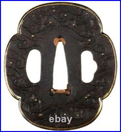 Antique Japanese Iron Tsuba Decorated with Waves, Droplets and Brass Fukurin