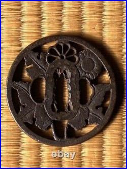 Japanese antique iron tsuba. Watermark chrysanthemum design. Early Edo period